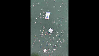 300 ‘aqua devils’ perform Jal Yoga in the backwaters of Krishna river
