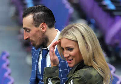 NHL star Brad Marchand’s wife, Katrina Marchand, poses in a short skirt with a friend on the ice rink in a viral off-season moment