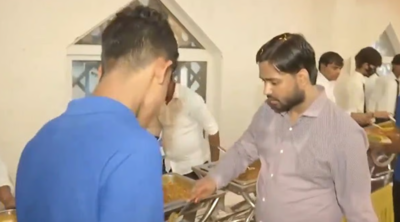  Viral YouTuber welcomes thousands of students with rose petals, serves them food personally
