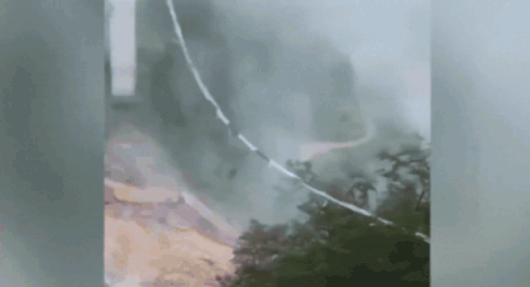 China bridge collapse: Truck hangs mid-air with driver inside - watch
