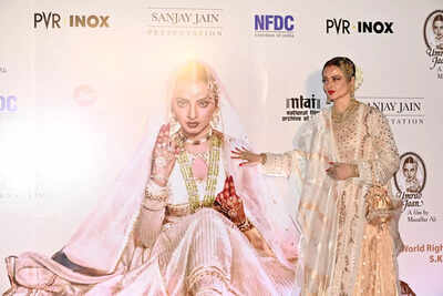 Rekha, the epitome of elegance, graced the Umrao Jaan screening in a custom Manish Malhotra ensemble, evoking nostalgia for her iconic role. Her traditional Indian attire, complete with a shimmering Banarasi dupatta and antique accessories, celebrated timeless craftsmanship. 'Umrao Jaan' Rekha shut down the red carpet in a gold-dripped anarkali-lehenga