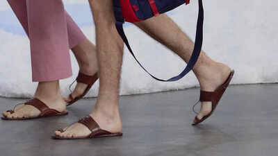 Prada faced criticism for featuring sandals in its Spring-Summer 2026 collection that closely resembled Kolhapuri chappals without acknowledging their origin. Following backlash, Lorenzo Bertelli of Prada admitted the design's inspiration from traditional Indian footwear and expressed interest in collaborating with local artisans. This incident highlights the need for proper credit and support for traditional crafts in the fashion industry. Prada finally admits its 'new' sandals are basically Kolhapuri chappals and India noticed