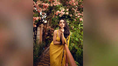 Mimi Chakraborty embraces monsoon charm in a radiant yellow sari