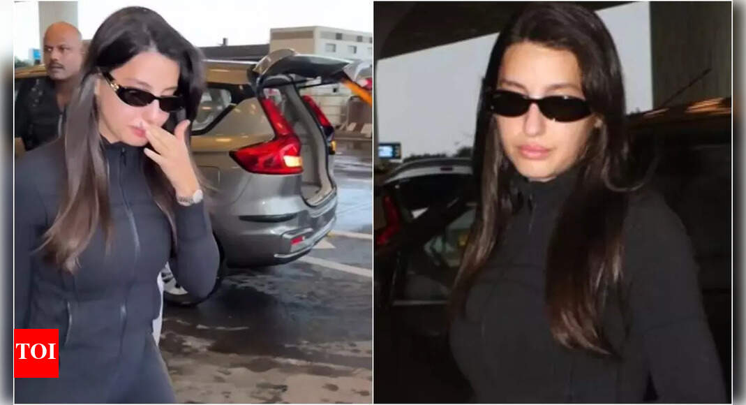 Nora Fatehi breaks down at Mumbai airport, her bodyguard pushes away fan during chaotic moment amid cryptic post about death | Hindi Movie News – Times of India