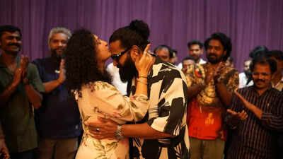 Rishab Shetty’s wife Pragathi Shetty kisses him affectionately while celebrating his 42nd birthday with the 'Kantara' crew