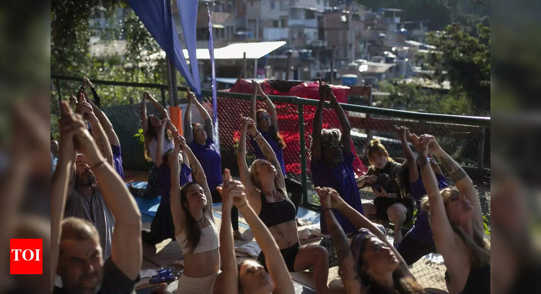 Yoga fever in Brazil: Dozens gather in Rio slum to train; free program targets low-income communities