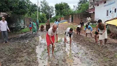 Villagers plant paddy on muddy road in Madhya Pradesh village to protest delay in road construction