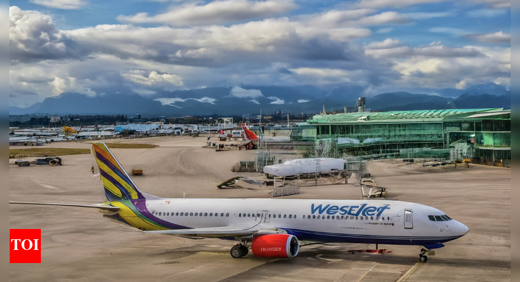 WestJet emergency evacuation: Engine fire on plane at Vancouver airport; 50 passengers use slides - Times of India