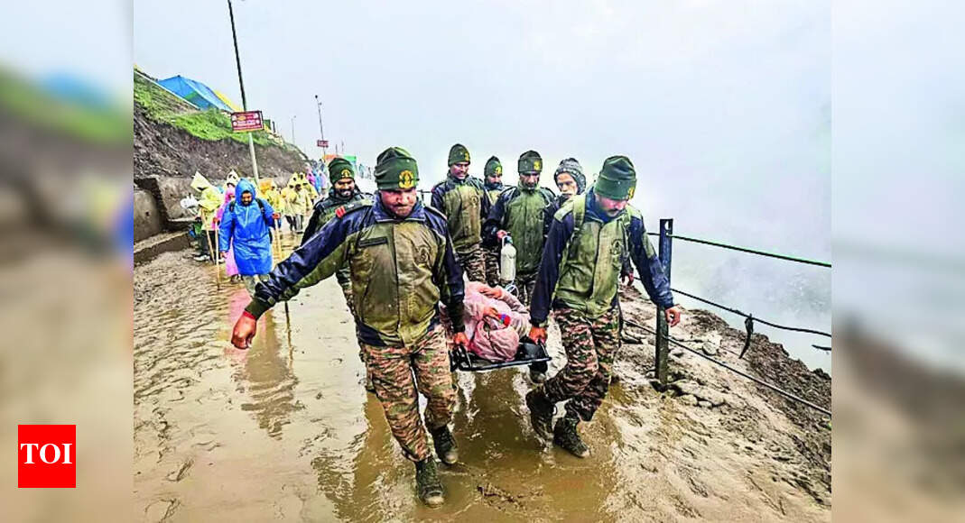 Rain-battered tracks halt Amarnath yatra; Army rescues 500 pilgrims stranded in landslides | India News - Times of India