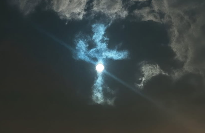 Miracle! Glowing cross-shaped cloud spotted in the Sydney sky on Good Friday