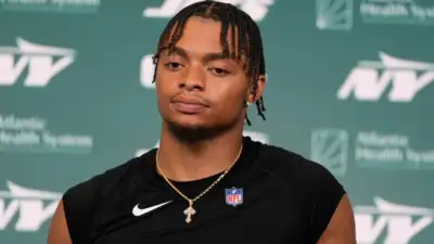 Justin Fields injury scare shocks Jets as QB leaves training camp on cart with painful leg injury