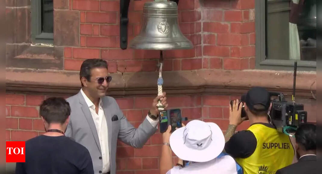Wasim Akram rings the five-minute bell ahead of Day 3 at Old Trafford