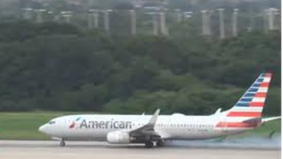  American Airlines aborts takeoff after gear malfunction; video shows passengers fleeing down slides as smoke engulfs plane