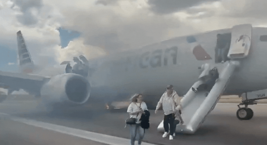 Panic on Denver Airport runway: American Airlines aborts takeoff after gear  malfunction; video shows passengers fleeing down slides as smoke engulfs  plane - Times of India