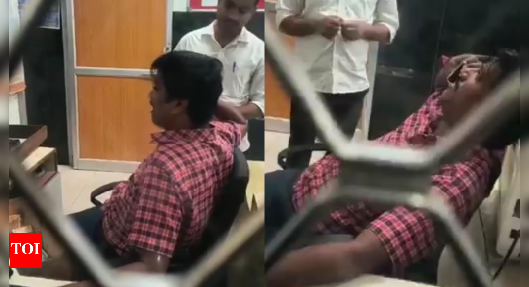 Watch: Viral video of Karnataka railway clerk on phone ignoring passengers sparks outrage; staff dismissed after backlash