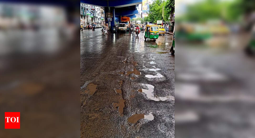 Major city roads become one-lane as cars avoid potholed stretches