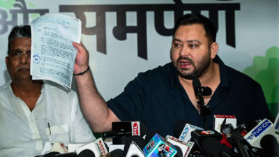 Tejashwi's dual voter ID row: EC issues notice to RJD leader, asks him to hand over EPIC card