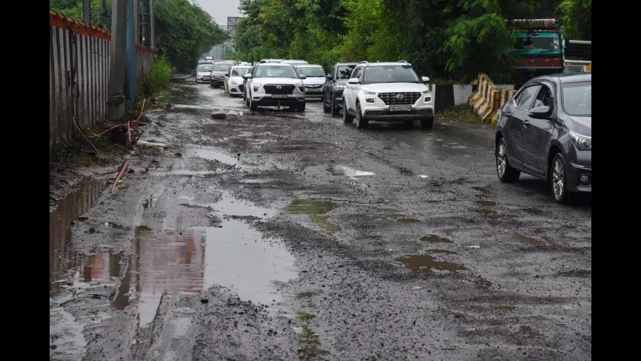 Roads crumble, craters surface in Noida after rain
