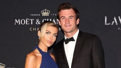 Tommy Paul shows affection for fiancee Paige Lorenze’s stunning business look at Dairy Boy press day