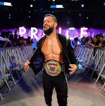Manchester United's misfortunes from UEFA reach WWE as Finn Balor mocks European giants with Tottenham Hotspur T-shirt and trophy sign
