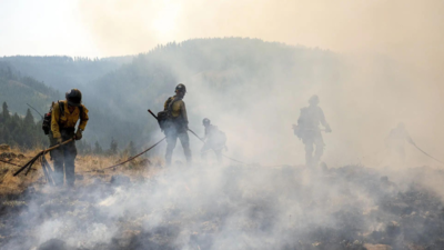  Two held while battling Washington blaze; ‘immoral’ Donald Trump policy slammed