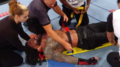  Roman Reigns taken out on a stretcher after huge victory over Bronson Reed