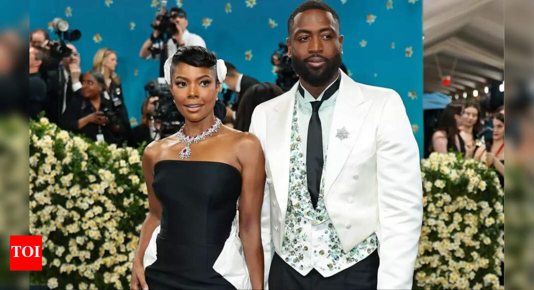 Dwyane Wade's wife Gabrielle Union turns head in white dress against vibrant graffiti wall during anniversary getaway