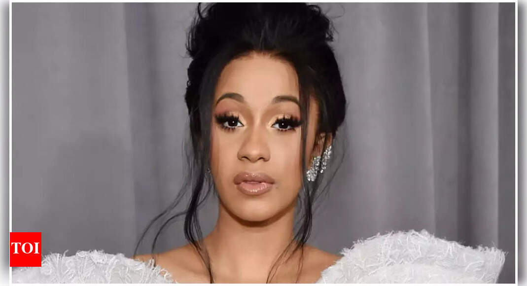 Cardi B throws pen at paparazzo asking about pregnancy outside court in viral video after winning civil assault lawsuit