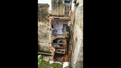 2 killed as 100-year-old building collapses amid heavy rain in city