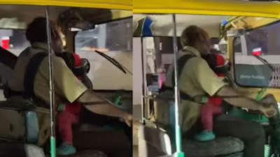 Baby in one arm, wheel in the other: Auto driver cradles infant while driving; video goes viral
