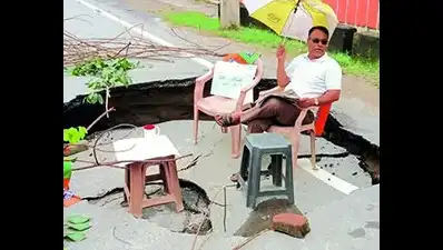 Road caves in, residents protest by having 'picnic' there