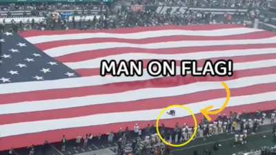 Hilarious moment as fan gets tangled in 100-yard American flag during National Anthem at MetLife Stadium