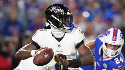 Lamar Jackson pushes Bills fan back into stands after helmet strike, igniting sideline chaos and social media frenzy