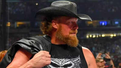Brock Lesnar reacts to his embarrassing wardrobe malfunction as he rips pants during WWE SmackDown appearance