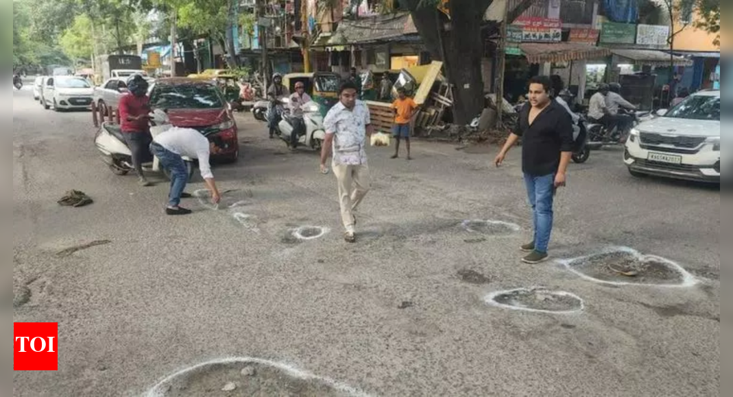 ‘Where is the MLA?’: Bengaluru residents mark potholes in protest