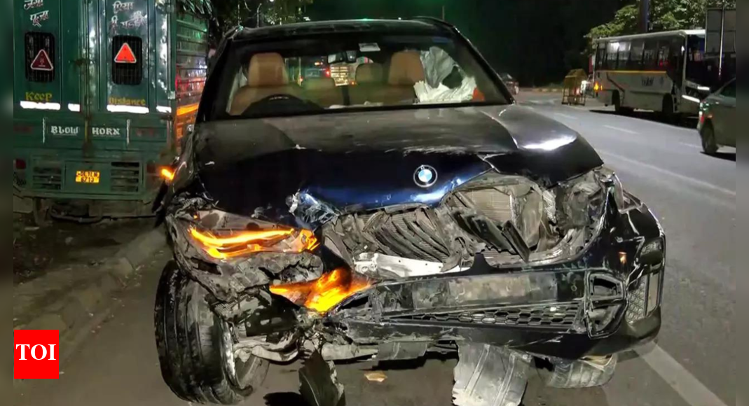<div>BMW rams bike: Accused driver arrested for official's death - shocking details of accident emerge</div>