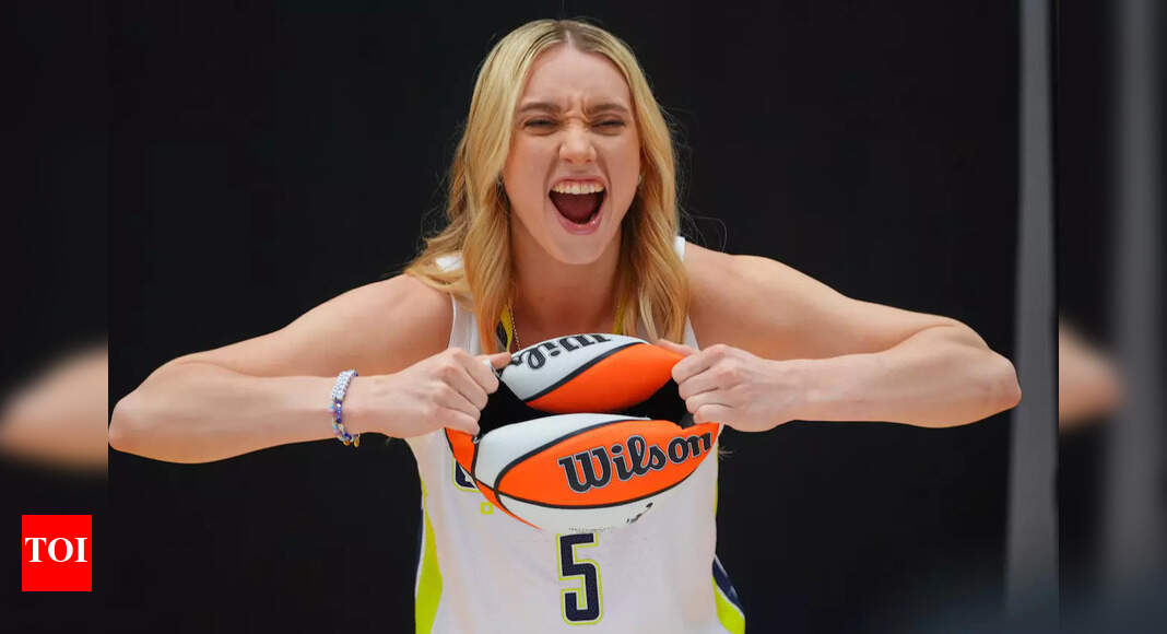 Paige Bueckers hooksteps her way through a guard of honor to receive WNBA Rookie of the Year award