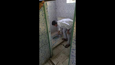 BJD's Pradeep Majhi protests by cleaning dialysis unit toilet in Nabarangpur