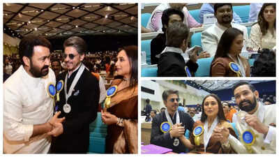 Shah rukh khan proudly shows off his national film award medal; Poses with Fellow Awardees Mohanlal and Rani Mukerji