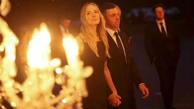 Rory McIlroy and woman  Erica Stoll clasp  hands astatine  Ryder Cup gala amid caller    matrimony  rumors