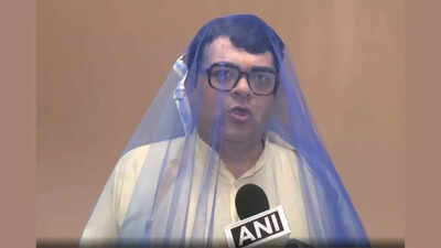  AAP person  dons mosquito nett  to sting BJP connected  dengue cases - watch