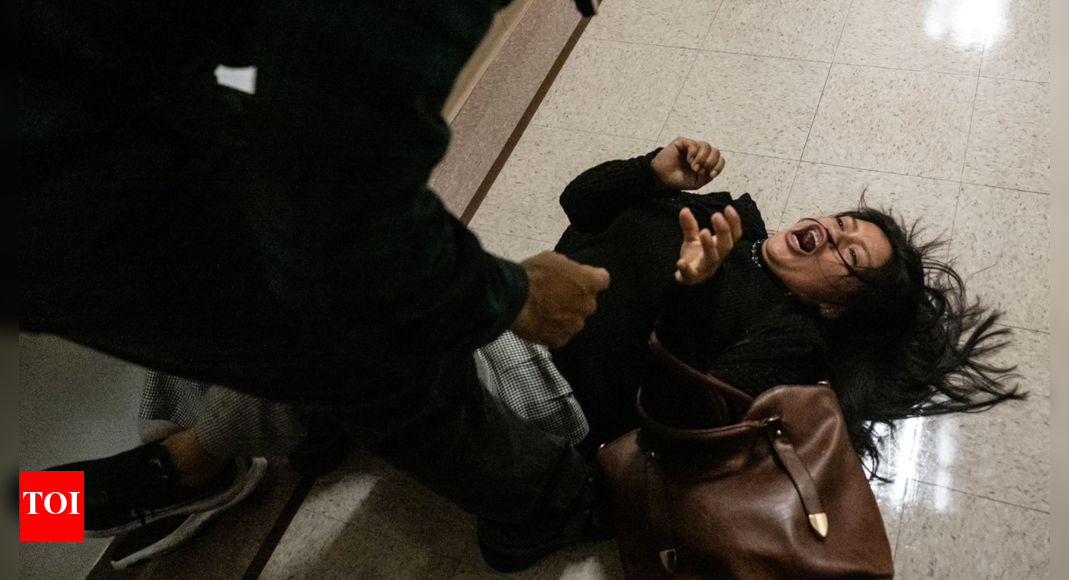 <div>Watch: ICE officer shoves women to floor; agency says 'relieved from current duties'</div>