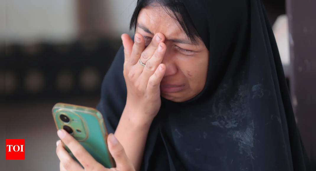 Indonesia families anxious for news after school collapse