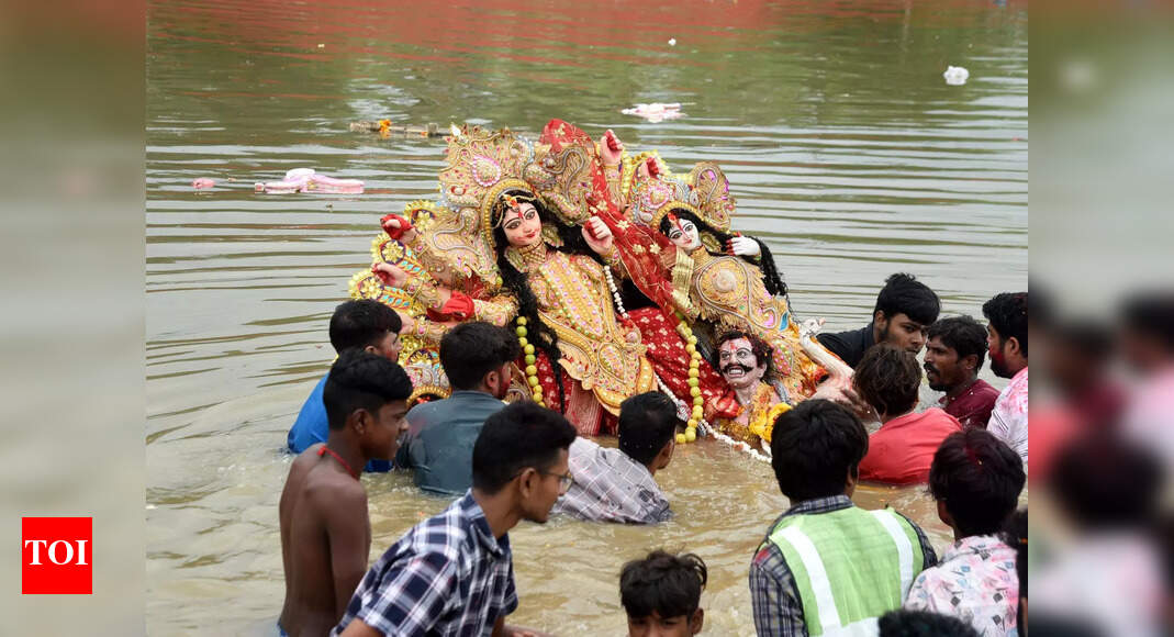 Durga idols immersed in artificial water bodies amid strict vigil