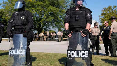 Tension in Chicago: Federal agents shoot woman, claiming they were 'boxed in' by 10 cars; she was an armed threat