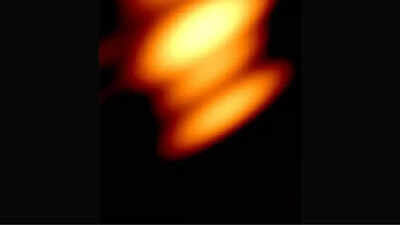 First-ever image captures two black holes orbiting each other