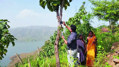 For government aid, they climb hills, tie phones to trees