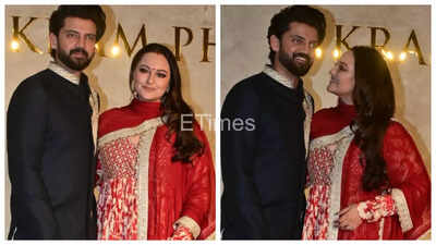 Sonakshi Sinha fuels pregnancy rumors after fans spot her covering her belly while posing with Zaheer Iqbal at Vikram Phadnis' fashion show