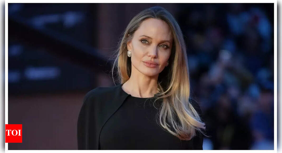 Angelina Jolie shows off back tattoo in backless dress at ‘Couture’ premiere – PICS | – The Times of India