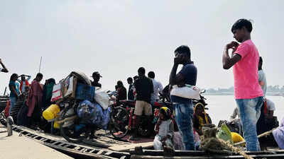 People of Rustampur under Raghopur assembly constituency cross the Ganga daily with their motorcycles on boats, relying on this lifeline in the absence of a permanent bridge  Tejashwi’s Raghopur awaits its turn at progress